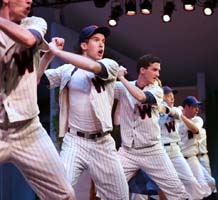 Actors in a scene from Damn Yankees.